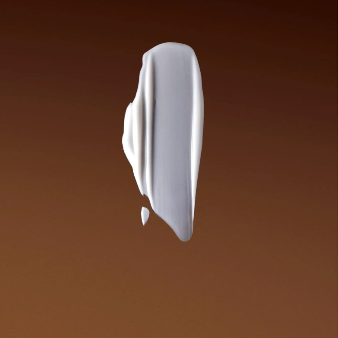 Kremaktig, hvit tekstur på varm brun bakgrunn for Dagkrem c-vitamin 60 ML - By Melyon med glatt finish